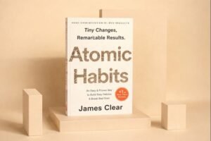 Atomic Habits book cover by James Clear explaining how small habits lead to remarkable results